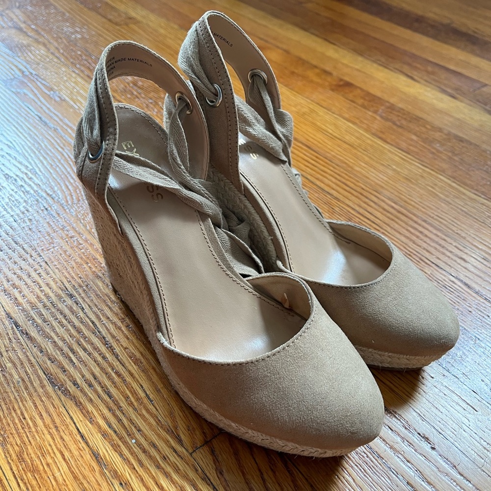 Lace-up espadrille wedges with interchangeable straps.